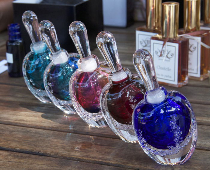 JoAnne Bassett hand blown glass bottles for her Limited Edition Collection, More Life Collection, and Luxury Natural Perfumes Collection