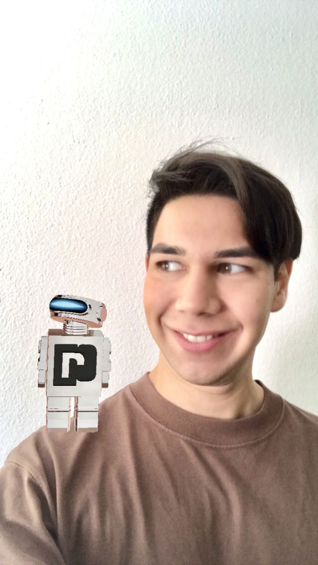 The robot on my shoulder is a virtual instagram filter. You can get the Phantom filter by activating the NFC tag reader on your phone and placing it on the robots head of the 100ml refillable bottle.