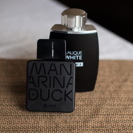 Mandarine Duck Black > PDM Layton > White on Black. I usually dislike vanilla, but the orange here makes it work.