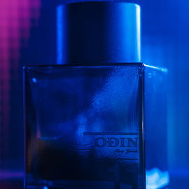 For this Fragrance Friday, once again, we have a friend's fragrance photographed + sniffed thoroughly. This time the 11 semma from Odin new york My friend's signature scent; spicy-woody greatness with tobacco and chili for people with virtue and high standards. It's said to be similar to Burberry London for men, so gave them a side-by- side sniff and the Burberry surely is alike, but the Odin is just a little better. And there are people who value that little difference and are willing to pay for it. So anyways, for the photo wanted to do something movie-like, neo-noir. There was a scene in Bullet Train, that especially inspired this photo. was also met by a challenge, namely, the bottle is being half empty(or half full; depends on the mood). This was a problem because, with my usual techniques, the brand name and the 11 would have not been visible and emphasized enough for my liking. Overall, I am very happy with the result. Hope you like it too. IG:kolinmarchand