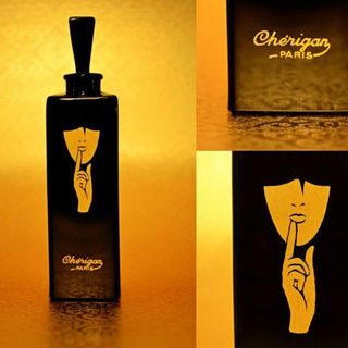 Extremely rare gilded black-glass flacon for Masquerades produced by Cristalleries de Nancy (1929). 10cm approx.