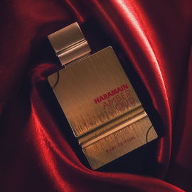 Happy #FragranceFriday! 🌺  Today, I'm excited to share with you my latest challenge- capturing the beauty of this stunning Al Harmain Amber Oud Ruby Edition perfume on camera.  It all started when a friend showed me a video of a perfume photoshoot, and I was immediately inspired to try it out myself. Little did I know, it would be one of the most challenging photos I've taken so far!  The intricate details of the bottle combined with the shiny red cloth made it difficult to capture the true visual essence of the perfume. But after multiple dozen attempts, I'm happy with the final result.  This fragrance is truly one of a kind, with its sweet and rich blend of almond and amber. It's the perfect addition to any perfume collection, especially considering the price.