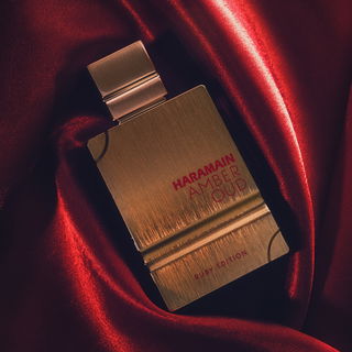 Happy #FragranceFriday! 🌺  Today, I'm excited to share with you my latest challenge- capturing the beauty of this stunning Al Harmain Amber Oud Ruby Edition perfume on camera.  It all started when a friend showed me a video of a perfume photoshoot, and I was immediately inspired to try it out myself. Little did I know, it would be one of the most challenging photos I've taken so far!  The intricate details of the bottle combined with the shiny red cloth made it difficult to capture the true visual essence of the perfume. But after multiple dozen attempts, I'm happy with the final result.  This fragrance is truly one of a kind, with its sweet and rich blend of almond and amber. It's the perfect addition to any perfume collection, especially considering the price.